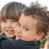 Two little boys hugging